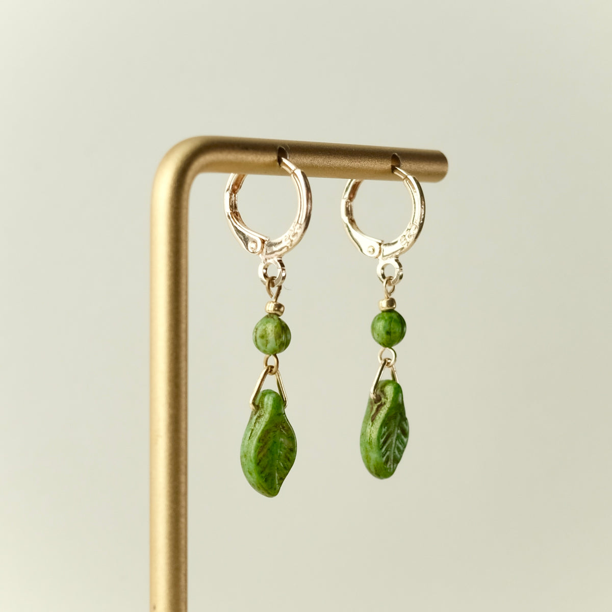 Mini green leaf Czech glass earrings
