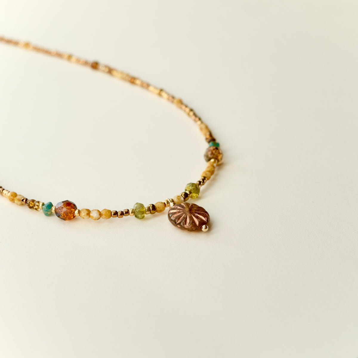 Antique bronze Czech glass sun necklace