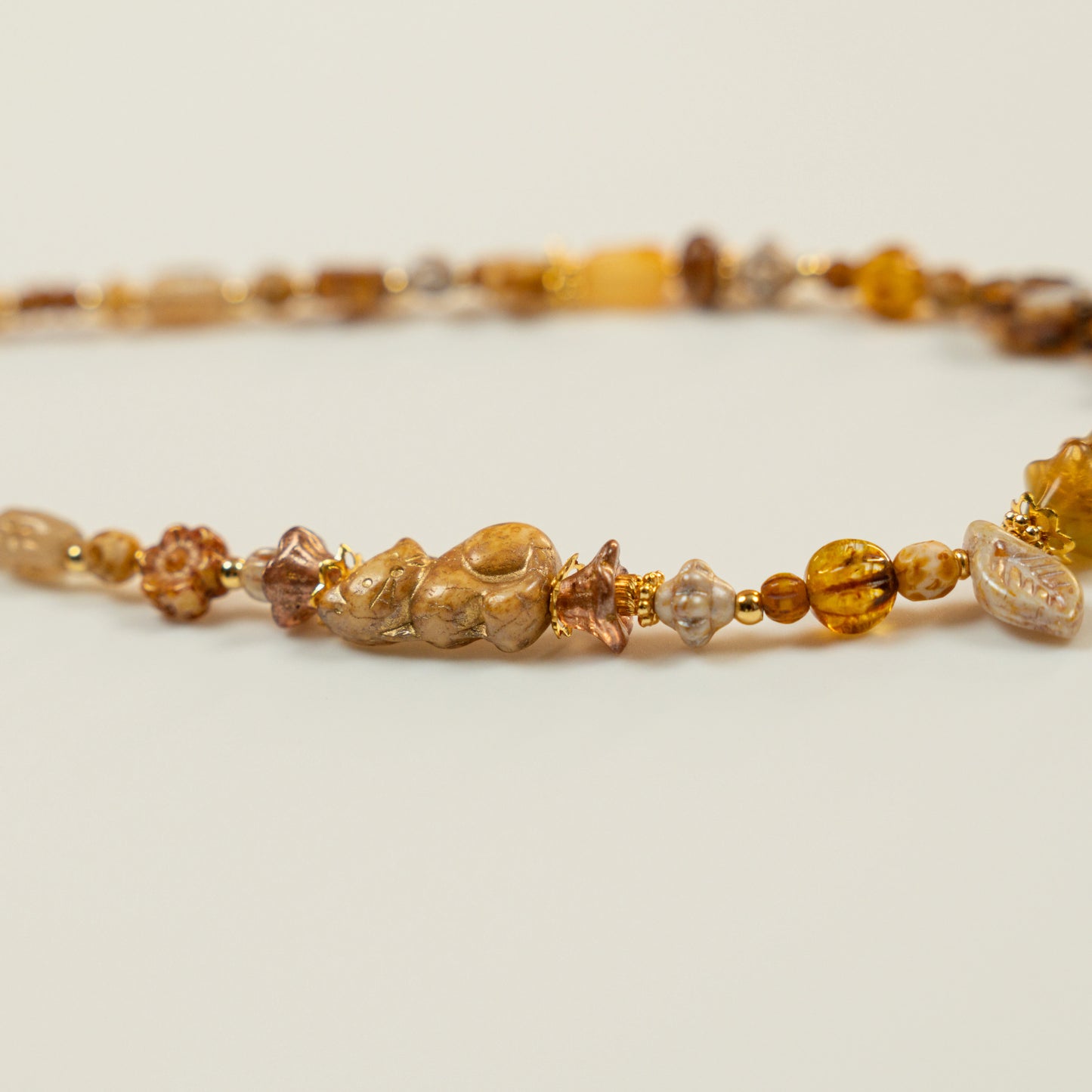 Kralenketting met paddenstoel hoofdkraal