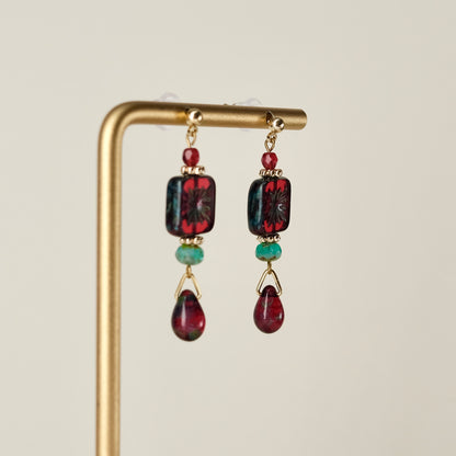 Red square Czech glass earrings with blue-green accents