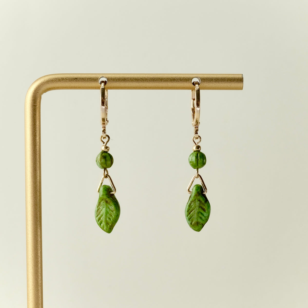 Mini green leaf Czech glass earrings