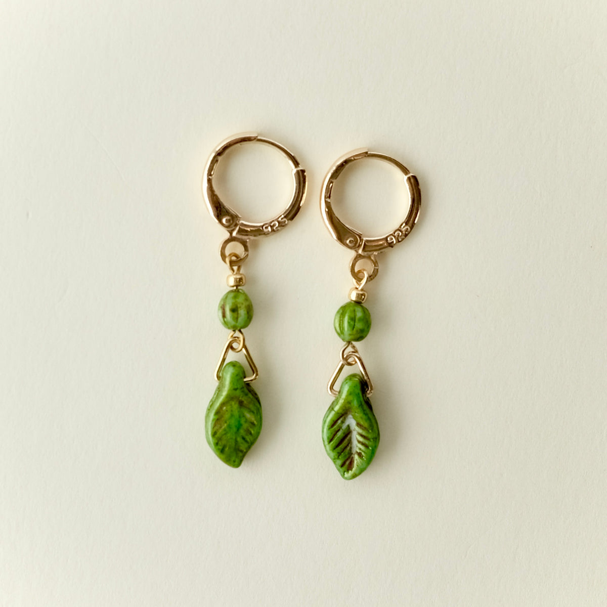 Mini green leaf Czech glass earrings