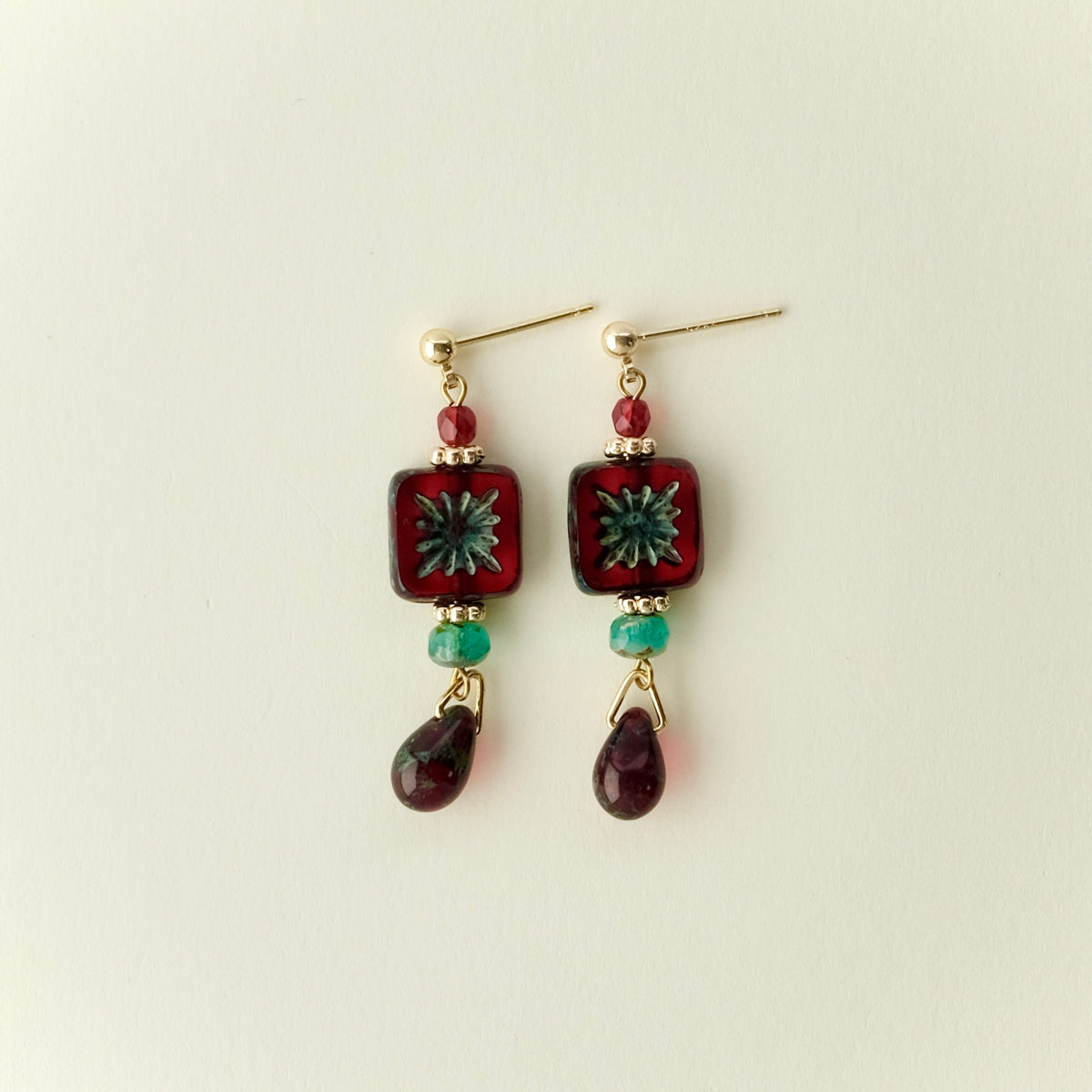 Red square Czech glass earrings with blue-green accents
