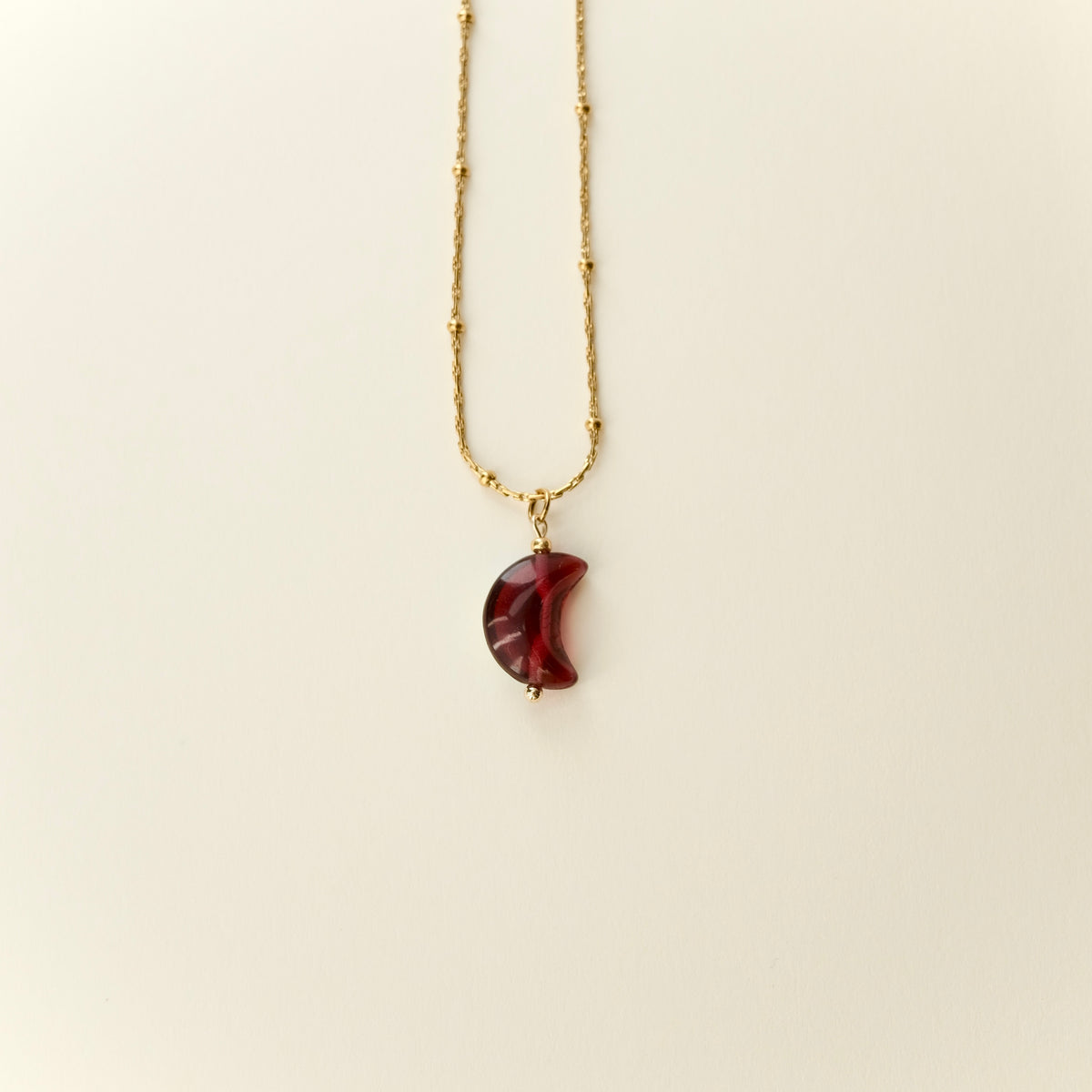 Double-sided fuchsia moon pendant